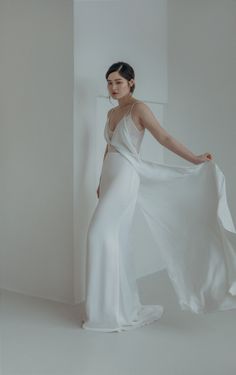 "Minimal yet sophisticated, CHLOE is a two-piece wedding dress consisting of a lace bodice sheath dress and satin crêpe slip overalls. The delicate straps and unique cut allow the slip overalls to hang and flow elegantly over the inner dress. DETAILS *Stretchable satin crêpe slip overalls with twist detail that flows down to a sweep train. *Inner dress consists of a French lace bodice with a low keyhole back and button opening. *Interchangeable between two comfortable looks for your wedding day. Two Piece Wedding Dress, Sheath Wedding, Beautiful Mask, Minimal Chic, Lace Bodice, French Lace, Unique Dresses, Dress Pattern, Sheath Wedding Dress