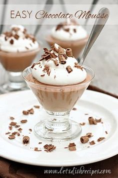 three desserts with chocolate and whipped cream on a plate