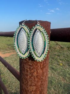 Beautiful beaded earrings. Teal, green and white colors. They are made with size 13 beads and backed with deerskin leather. They are large but lightweight. Handmade Southwestern Green Earrings, Handmade Southwestern Green Beaded Earrings, Southwestern Green Beaded Dangling Earrings, Southwestern Green Earrings With Colorful Beads, Southwestern Style Green Earrings With Colorful Beads, Southwestern Green Beaded Dangle Earrings, Artisan Adjustable Green Beaded Earrings, Southwestern Green Earrings With Dangling Beads, Adjustable Green Beaded Earrings With Large Beads