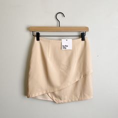 Nwt By The Way. Nude Asymmetric Mini Skirt Size Xs Beautiful Nude Beige Colored Mini Skirt With An Asymmetric Layered Detail. From Revolve. Hidden Zipper In Back Hook And Eye Closure Polyester/Spandex Hand Wash Waist: 12.75“ Length: 15.5“ In Perfect Nwt Condition! W5 Summer Night Out Skirt With Side Zipper, Summer Workwear Wrap Skirt With Asymmetrical Hem, Summer Asymmetrical Hem Wrap Skirt For Work, Summer Wrap Skirt With Asymmetrical Hem For Workwear, Asymmetrical Summer Skirt For Workwear, Fitted Asymmetrical Mini Skirt For Spring, Spring High Waist Fitted Draped Skirt, Spring Asymmetrical Mini Skirt For Workwear, Asymmetrical Mini Skirt For Spring Workwear