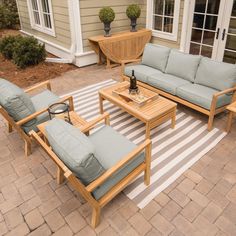 an outdoor patio with furniture and potted plants