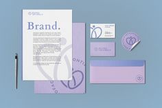 the brand identity and stationery is displayed on a blue background