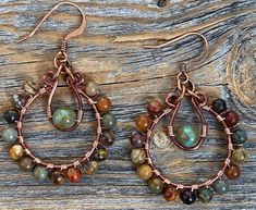 Handmade Adjustable Hoop Earrings, Bohemian Hoop Wrap Earrings As Gift, Unique Wire Wrapped Dangle Hoop Earrings, Bohemian Hoop Wrap Earrings For Gift, Adjustable Artisan Teardrop Hoop Earrings, Adjustable Teardrop Artisan Hoop Earrings, Artisan Wire Wrapped Drop Hoop Earrings, Handmade Copper Teardrop Hoop Earrings, Red Bohemian Hoop Earrings With Ear Wire