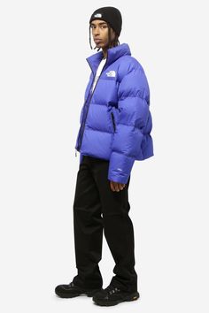 RMST NUPTSE jacket in blue nylon, 100% nylon, padding, long sleeves, turtleneck, top zip closure, front and back logo, side pockets, hidden hood, model high is 180 cm, the model wears a size L | The North Face Men's Rmst Nuptse Jacket in Blue | FW22/23 Nuptse Jacket, Hidden Hood, Turtleneck Top, North Face Mens, The Model, North Face, The North Face, Puffer, Winter Jackets