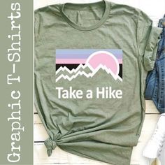 Take A Hike Round Neck T-Shirt Color: Green Size: X-Large Material: 65% Cotton And 35% Polyester Care: Hand Wash Cold Water (See Label Instructions) Length: Approximately 28” Pit To Pit: Approximately 21.5” Ii0614 Green Graphic Tee For Outdoor, Green Crew Neck T-shirt For Outdoor Activities, Casual Slogan T-shirt For Outdoor, Spring Graphic Print Tops For Outdoor, Trendy Outdoor Relaxed Fit T-shirt, Trendy Relaxed Fit T-shirt For Outdoor, Outdoor Green T-shirt With Graphic Print, Green Graphic Tee For Outdoor Activities, Letter Print T-shirt For Outdoor In Spring