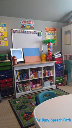 a child's playroom with toys and books