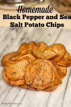 homemade black pepper and sesame salt potato chips on a marble counter top with text overlay