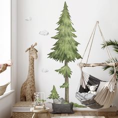 a child's room with a wall mural and hammock