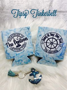 two key chains with the words tipsy tinkerbell and an anchor on them