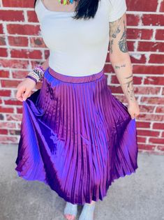 Playfully strut your stuff in this Pleated A-Line Satin Feel Midi Skirt, guaranteed to add a touch of whimsical charm to any outfit. True to size fit! Small: 2/4 Medium: 4/6 Large: 8/10 Disclaimers; Our product colors may vary due to lighting and screen resolutions. Purple Pleated Bottoms For Spring, Trendy Pleated Stretch Skirt, Trendy Stretch Pleated Skirt, Purple Stretch Skirt For Night Out, Stretch Purple Skirt For Night Out, Spring Purple Pleated Skirt, Spring Party Skirt In Purple, Purple Skirt For Fall Party, Purple Party Skirt For Spring