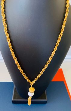 This vintage long gold tone tassel necklace has a 24inch long rope chain with a 3 inch long chain and gold and white bead and tassel. A perfect vintage necklace to fritter with. The necklace is in great condition. I specialize in finding fun wearable jewelry. Please browse my shop for more options. I box jewelry sales ready to be given as gifts. I Box, Wearable Jewelry, Wire Cuff, Long Rope, Layered Chain, Layered Chains, Vintage Texture, Box Jewelry, Copper Bracelet