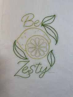 embroidered dish towel with the words be zesty on it