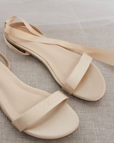 Classy satin flat sandals with ballerina lace up. Effortless yet adorable to wear on your favorite occasion. Can be pair with dress or casual look.DETAILS:COLORS AVAILABLE: Ivory, White, Pink, Light Blue, and ChampagneUPPER: Synthetic upper and liningMATERIALS: Mandmade outsoleSTYLE NAME: MADDY-W