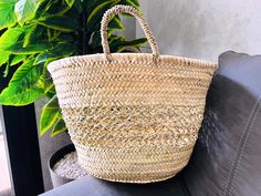 "This bag is handwoven in the souks of Morocco, from a palm leaf. It is a \"Slow Fashion\" product representing everything that is eco, ethical and green. Even though this Spring & Summer season is all about straw 🤍 Small round wicker French basket, hand woven in Marrakesh by friends and family. Ideal small shopper or beach bag. Also a perfect bag or gift for a girl - great for school books etc. This braided bag is perfect anytime and everywhere, Especially in the summer and there are those who Natural Beach Bag For Summer, Natural Summer Beach Bag, Fair Trade Basket Beach Bag For Summer, Natural Straw Bag As Gift, Fair Trade Palm Leaf Straw Bag For Summer, Traditional Palm Leaf Straw Bag For Summer, Straw Bag As Gift, Natural Straw Beach Bag As Gift, Fair Trade Natural Beach Bag For Summer