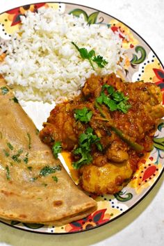 a plate with rice, chicken and tortilla on it