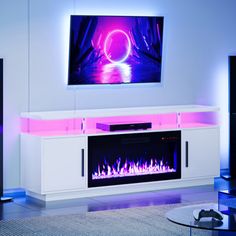 a living room with a television and fireplace in the center, surrounded by blue lights