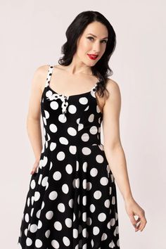 Get spotted in the Dolores Polka Dress, a playful and printed viscose knee length dress. With a sweetheart neckline and contrasting white tie, this fitted dress flares out from the waist for a fun and flirty look. Adjustable straps and a zip fastening make for a comfortable and easy fit. Made from 100% Viscose, this dress is sure to turn heads. Printed viscose knee length dress Print is black base with large white polka dots Sweetheart neckline that has a contrasting white tie Fitted dress at ch Patch Dress, Ballerina Shoes Flats, Gala Dresses, Polka Dress, Wiggle Dress, Look Vintage, White Tie, Cardigan Tops, Pencil Dress