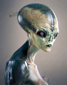 an alien looking man with blue eyes and green skin is standing in front of a gray background