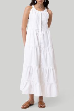 Look effortlessly elegant with our Reistor Embroidrered Tiered Maxi Dress. This pristine white dress is crafted with organic cotton which makes it such a comfy, versatile piece. This sleeveless dress has intricate cutwork embroidery on its yoke, and is the perfect blend of style and practicality. With conveniently placed pockets and a series of tiers, this dress offers both charm and comfort, making it a forever favorite! Wash in cold water or dry clean only Do not soak bleach or wring Line dry Cotton Broderie Anglaise Maxi Dress, Cotton Maxi Dress With Broderie Anglaise For Daywear, White Cotton Maxi Dress With Broderie Anglaise, White Broderie Anglaise Sleeveless Maxi Dress, White Sleeveless Broderie Anglaise Maxi Dress, White Sleeveless Maxi Dress With Broderie Anglaise, White Cotton Dress With Broderie Anglaise, Elegant White Cotton Maxi Dress, Cutwork Embroidery