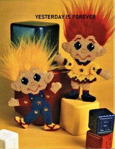 an advertisement for troll twins toys and dolls featuring two clowns with red hair on their heads