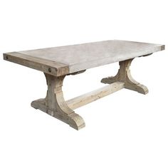 a wooden table with concrete top and legs