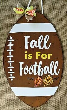 a wooden sign that says fall is for football