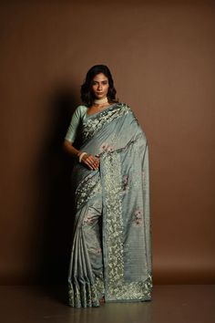 Sage Green Satin Silk Saree with Floral Prints and Parsi Gara Border - Anvi Couture Elegant Pre-draped Saree With Floral Embroidery In Tissue Silk, Elegant Pre-draped Saree With Floral Embroidery In Art Silk, Elegant Pista Green Dola Silk Pre-draped Saree, Elegant Pre-draped Saree With Printed Border For Designer Wear, Wedding Tussar Silk Saree With Floral Embroidery, Wedding Tussar Silk Pre-draped Saree With Floral Embroidery, Wedding Art Silk Pre-draped Saree With Floral Print, Elegant Green Blouse With Floral Embroidery, Elegant Blouse Piece With Floral Print For Reception