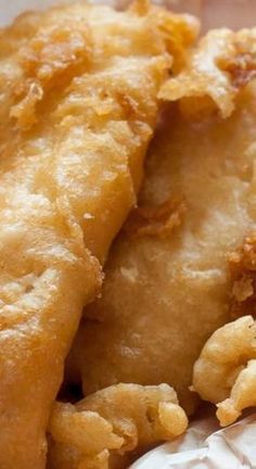 closeup of fried food item in paper wrapper