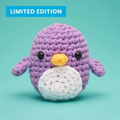 a small crocheted penguin sitting on top of a blue background with the caption limited edition