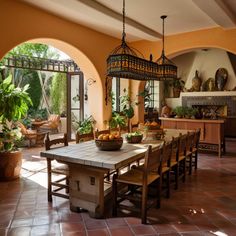 a dining room with an island table and potted plants in the center, surrounded by arched doorways