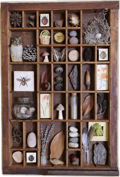 a wooden box filled with lots of different types of rocks and stones on top of each other