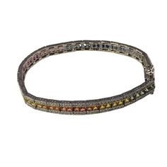 14 Karat White Gold Diamond and Natural Multi Sapphire Rainbow Style Bracelet  This lovely bracelet features 274 round brilliant cut diamonds and 69 French cut natural sapphires set in 14K white gold. Width: 6 mm.  Total sapphire weight: 7.59 ct.  Total diamond weight: 1.50 ct.  Diamond color: H-I  Diamond clarity: SI1-SI2  Size: 7 inches  Weight: 10.2 dwt. / 15.9 gr.  Stamped: 14K  JAGi Certificate included. Multicolor Cubic Zirconia Tennis Bracelet For Formal Occasions, Sterling Silver Diamond Bracelet With Gemstone, White Gold Diamond Bracelet With Gemstone, Multicolor Diamond Bracelet With 17 Jewels, Formal Multicolor Cubic Zirconia Tennis Bracelet, Multicolor Jubilee Diamond Bracelet For Formal Occasions, Luxury Multicolor Diamond Tennis Bracelet, Fine Jewelry Silver Diamond Bracelet With Multi-stones, Multi-stone Diamond Tennis Bracelet