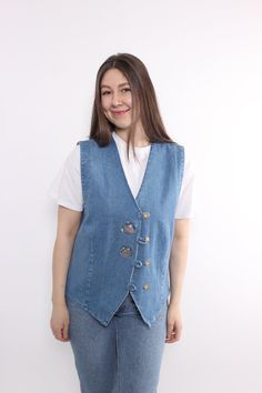 Hi! This is vintage from 90s denim vest in blue color. This  flowers embroidery folk blue vest made of DENIM. The model in the photo is 170 cm tall and is wearing a MEDIUM size vest. ( 44 - size on the tag).  But, be careful, this is a vintage size, it is better to check the measurements below in the product description. Width - 51cm / 20.07inch; Length - 64cm / 25.19inch. All measurements are taken seam to seam while lying flat. Sleeve measurement made from armpit to end of sleeve. This item is vintage, so it can have some defects. Additional photos can be send We are glad that you are interested in lots that we sell. Wish you a good shopping! FOLLOW US : Instagram: https://www.instagram.com/olena_vintage Visit TARASCOMMON.ETSY.COM for more cool vintage items. Sleeve Measurement, Blue Vest, Flowers Embroidery, Jean Vintage, 90s Denim, Blue Vests, Vest Outfits, Cool Vintage, Denim Vest