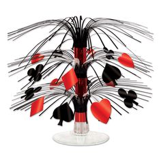 a vase filled with red and black hearts