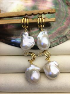 "This pearl is genuine freshwater pearl, 100% real pearl quantity: 1 pair metal: sterling silver  metal color: Silver pearl luster: high++ pearl body: AA+ pearl shape: baroque pearl color: white,please look at picture pearl size: 14-16mm--width x20-28mm--length Back to Other Jewelry Section 01: \"Tahitian,Akoya,Sea Pearl\" Section: https://www.etsy.com/shop/WenPearls?section_id=15806339 02: \"Potato/Near Round Pearl\" Section: https://www.etsy.com/shop/WenPearls?section_id=16378067 03: \"Round P White Baroque Pearl Earrings, Round Shape, White Baroque Pearl Earrings With High Luster, White Lustrous Baroque Pearl Earrings, White High Luster Baroque Pearl Earrings, Leather Pearl Jewelry, Jewelry Wishlist, Big Pearl, Pearl Leather, Sea Pearl