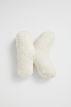 a pair of white mittens on a white background