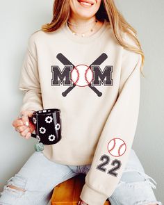 This cute Baseball Mom sweatshirt is fun to customize with your team colors and kids' names on the sleeve. It's perfect for those chilly spring days at practice and games. Printed on high-quality Gildan sweatshirts with water-based inks, it'll last season after season! ⭐Details: ✨ Gildan 18000 ✨ Classic fit ✨ Runs true to size ✨ Medium-heavy fabric ✨ Tear-away label ✨ 50% cotton, 50% polyester ⭐Care: Machine cold inside out (max 40C or 105F); Tumble dry: low heat; Do not dry-clean. ⭐Current Prod Team Spirit Sweatshirt With Team Name For Baseball Season, Team-colored Sweatshirt With Team Name For Baseball Season, Team-colored Baseball Sweatshirt With Team Name, Baseball Season Sweatshirt For Sports Events With School Spirit, Baseball Season Fan Apparel Sweatshirt With Letter Print, School Spirit Sweatshirt For Sports Events And Baseball Season, Customizable Fan Gear Sweatshirt, Baseball Season Sweatshirt With Team Name For Sports Events, Baseball Season Sweatshirt For Sports Events With Team Name