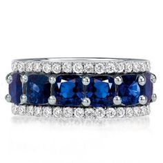 a blue and white diamond ring with three rows of diamonds on each band, set in 18k white gold