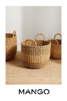 three woven baskets sitting on top of a table next to each other with the word mango written