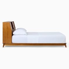 a bed with a wooden headboard and foot board on it's side, against a white background