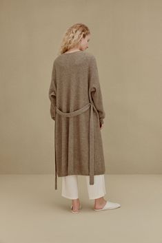 Knitted Coat Cozy Taupe Cardigan For Winter, Cozy Taupe Winter Cardigan, Beige Cashmere Sweater Coat For Spring, Versatile Knit Outerwear With Relaxed Fit, Long Beige Cozy Outerwear, Beige Long Cozy Outerwear, Long Neutral Outerwear For Winter, Chic Long Sweater Coat For Loungewear, Neutral Long Winter Outerwear