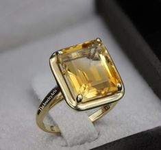 "Most Welcome to \"TheJewelryArts\" Products Description Center Stone: Genuine Golden Topaz Center Stone Size: 10x12mm Stone Shape: Emerald Cut Stone Clarity: VVS Material: 92.5 Sterling Silver, also available in 24k Rose Gold Vermeil/Gold Vermeil/Black Vermeil Stamp: 92.5 ➽OCCASION: Surprise your loved one with this beautiful engagement/wedding jewelry by TheJewelryArts . A classic piece of jewelry for all men/women in your life, this is a perfect gift for any occasion such as birthdays, anniversaries, wedding, engagements, Valentine's Day or Christmas day mother's day. ✔Comfort Fit ✔Nickel Free ✔Free Engraving ✔ Free Shipping ✔  Ready to Ship in 3 Business Day Customization is always welcome and please feel free to contact with me if you have any design ideas! If you have any other query Yellow Topaz Ring, Yellow Gemstone Ring, Citrine Engagement Ring, Yellow Citrine Ring, Citrine Ring Engagement, Woman Ring, Citrine Jewelry, High Jewellery, Rings Vintage