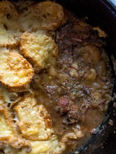 some food is cooking in a pot on top of a stove burner and it looks like something out of the oven