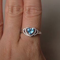 This is a gorgeous handmade creation. Its beauty is its simplicity & Elegance. The 6*6 mm heart cut faceted real Swiss Blue Topaz is crafted in solid sterling silver and with rhodium plated. All item is sent in a beautiful gift box If you have any idea of design your ring,pls contact me directly. You can realize more lovely stuff clicking the link https://www.etsy.com/shop/knightjewelry?refshopsection_shophome_leftnav Please leave the correct address and you phone number for delivering succe Blue Heart Cut Ring For Gift, Blue Topaz Heart Cut Promise Ring, Silver Heart Cut Topaz Ring Gift, Gift Topaz Ring With Accent Stones, Heart Cut, Heart-shaped Topaz Ring For Gift, Heart Wedding Rings, Swiss Blue Topaz Ring, Swiss Blue Topaz, Wedding Rings Unique