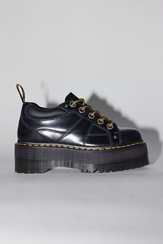 Dr. Martens 5-Eye Quad Max shoes. Extra-stompy Quads from Dr. Martens. 5-eye shoe by Dr. Martens made with a padded collar and air-cushioned sole, now with an empowering max platform and premium leather. Complete with a Goodyear welt and classic Docs DNA like grooved edges and visible stitching. Features Dr. Martens 5-Eye Quad Max shoes Platform Docs with a Quad Max sole Lace-up style Content + Care Leather, rubber Spot clean Imported Size + Fit Platform: 1.75" Heel: 2.25" | Dr. Martens 5-Eye Quad Max Shoe in Black, Women's at Urban Outfitters Dr Martens Quad, Doc Marten Shoes, Doc Marten Platform, Platform Docs, Platform Dr Martens, Doc Martens 1460, Dr Martens Platform, Platform Doc Martens, Shoe Inspo