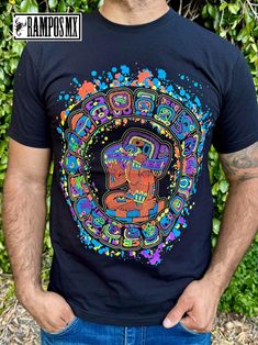 Handmade Serigraphy Print, Mexican Mens Aztec Warrior Piramids T-Shirts Graphic Tees that are super stylish , bright and glow in Blacklight , Neon Lights, Mexican Art Skull Luchador shirts , made by Artisans in Mexico in several designs . Mexican men Shirts. Short sleeve Men's apparel made of ultrasoft 100% cotton, this comfortable style is designed with a classic crew neckline, short sleeves and relaxed Fit, Our t-shirt is a perfect gift for that special person near you. Playera Mexicana de Luchador Santo Artesanal.  Please check the Product images for Size measurements guide Follow us in Instagram and Facebook: @RamposMX Multicolor Screen Print Tops For Fan Merchandise, Short Sleeve T-shirt With Sublimation Print For Festival, Multicolor Short Sleeve T-shirt For Festivals, Black Graphic Tee For Festivals, Black Graphic Tee For Festival, Artistic Graphic Print Festival Tops, Artistic Graphic Print Tops For Festivals, Black Graphic Tee With Glow In The Dark Details, Black Short Sleeve Glow In The Dark T-shirt