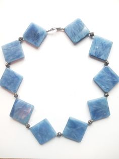 Beautiful Blue Crystal Square Shaped Stone Link Geometric Style Chain Statement Necklace Light Blue Single Strand Jewelry For Jewelry Making, Blue Costume Jewelry Necklaces With Lobster Clasp, Bohemian Blue Rectangular Necklace, Blue Rectangular Faceted Jewelry, Handmade Blue Rectangular Necklace, Blue Beaded Rectangular Jewelry, Blue Rectangular Beaded Jewelry, Adjustable Blue Faceted Necklace, Blue Single Strand Costume Jewelry