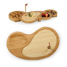 two wooden trays with different types of food on them, one is shaped like an egg