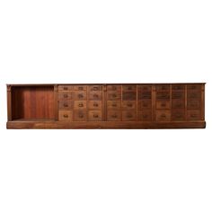 a large wooden cabinet with many drawers