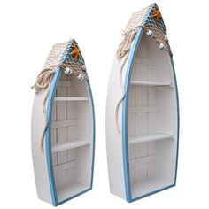 two white and blue boats shaped shelves with rope on each one's sides, set against a white background